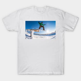 Snowboarder jumping against blue sky T-Shirt